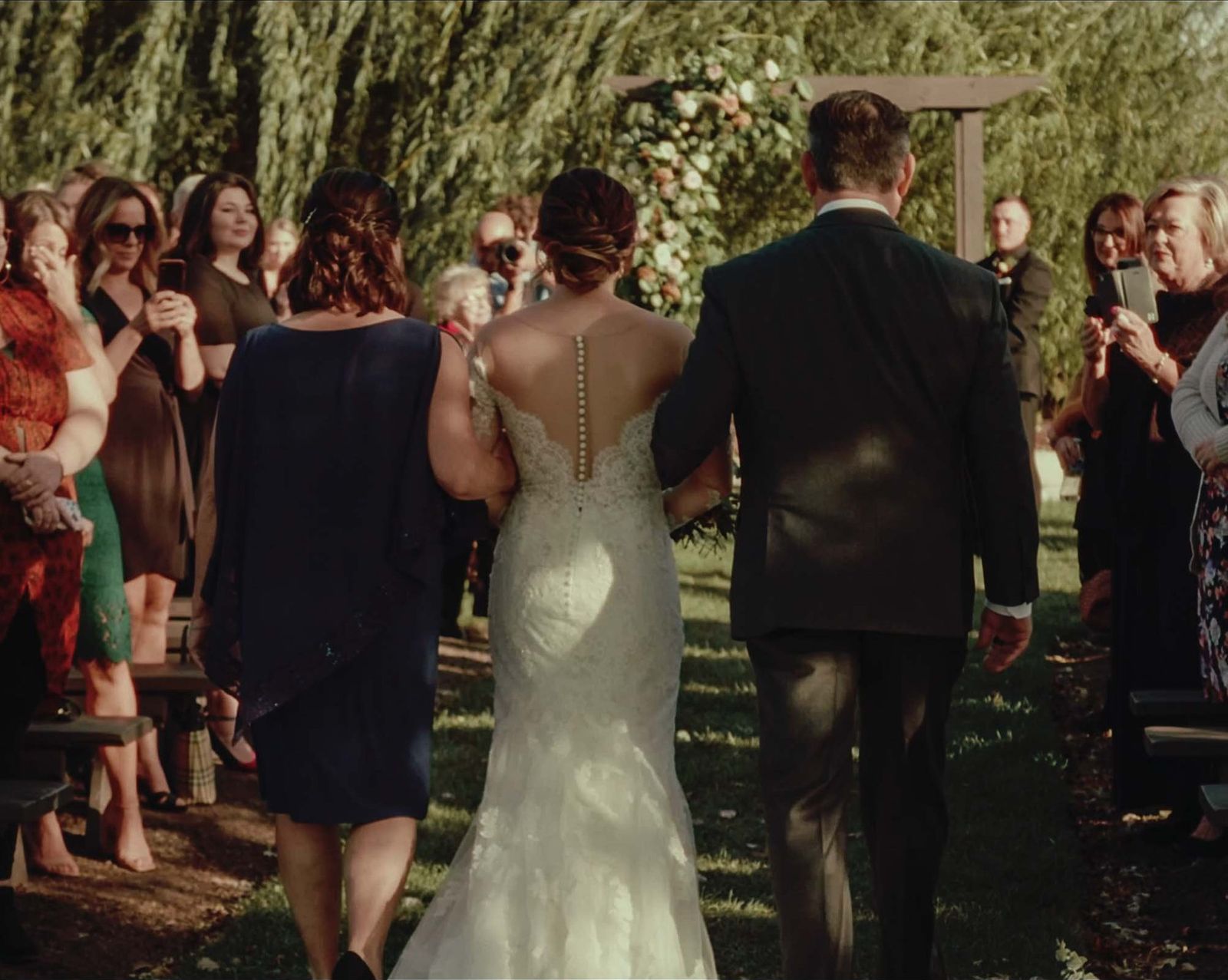Bride walked down the aisle by her parents